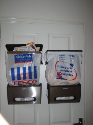 Two door mounted kitchen carrier bag bins