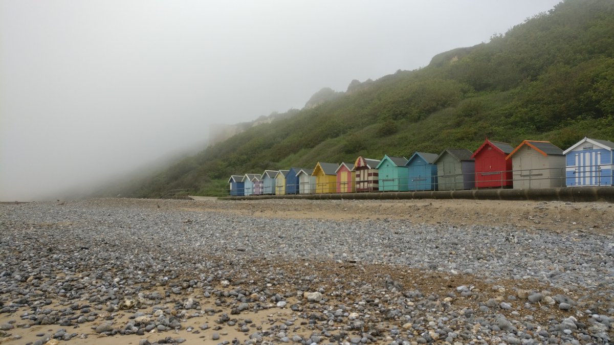 Cromer beach huts and mist