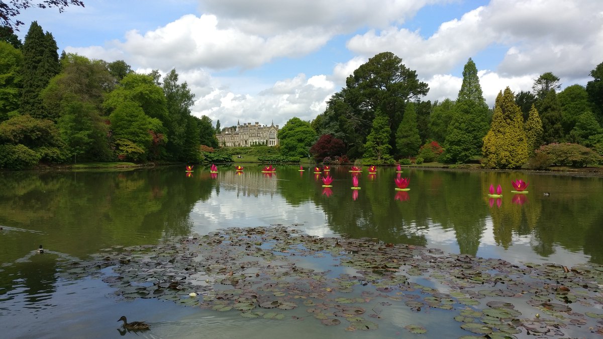 House and gardens with water reflection