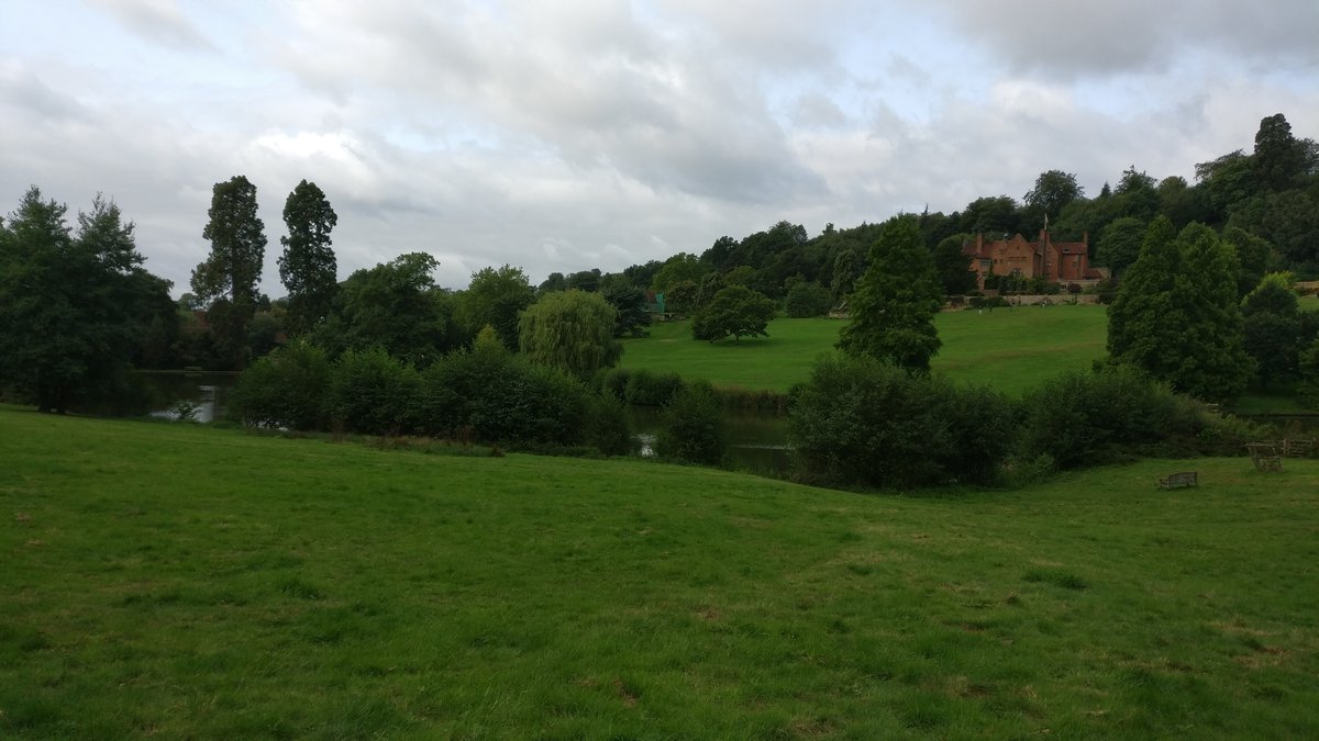 Building past fields and trees